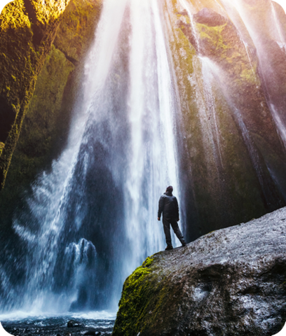 Person looking at waterfall